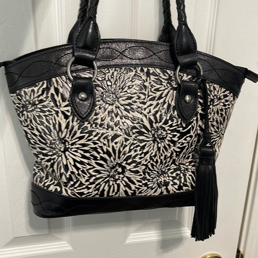 Patricia Nash leather Black and White Leather handbag. Tooled floral design.